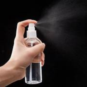 Picture of Woman spraying a bottle
