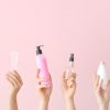 Spray bottles being held