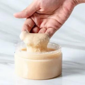 Picture of Womans Fingertips Dipping in Sugar Scrub